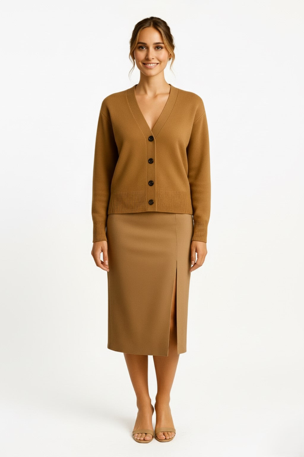 Woman wearing a cashmere cardigan and pencil skirt on a white background