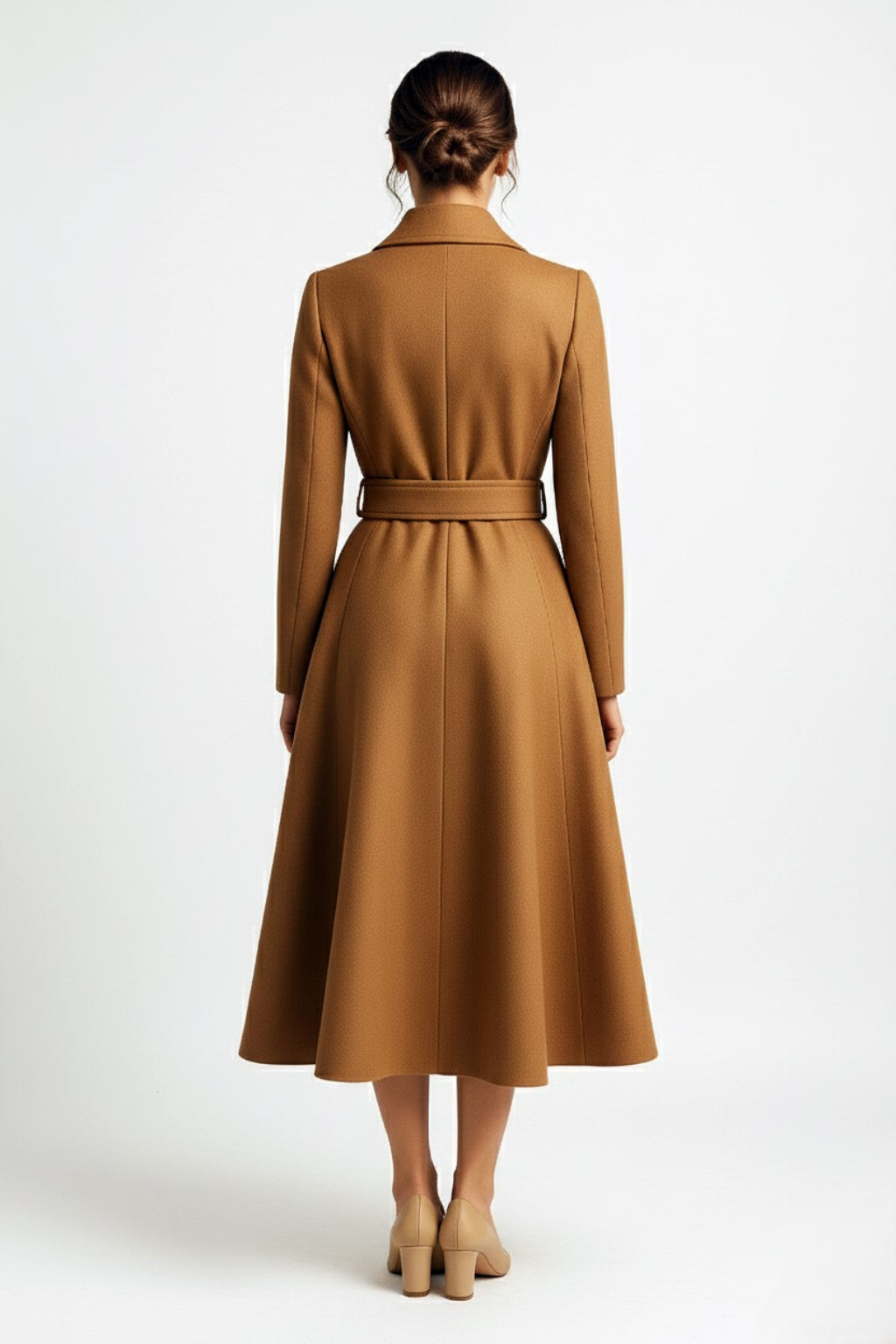 Woman wearing a camel cashmere coat on a white background