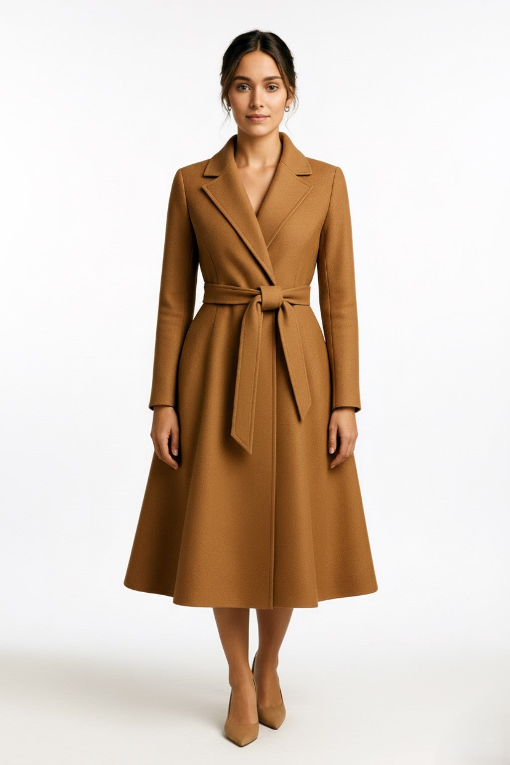 Woman wearing a camel cashmere coat on a white background