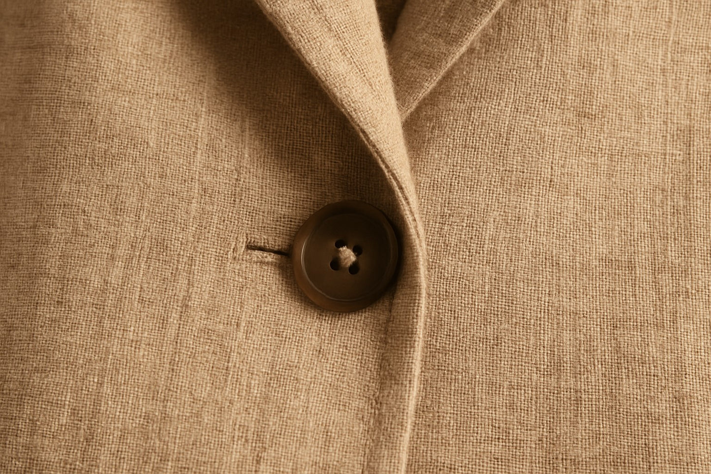 Close-up of a button on a linen blazer.