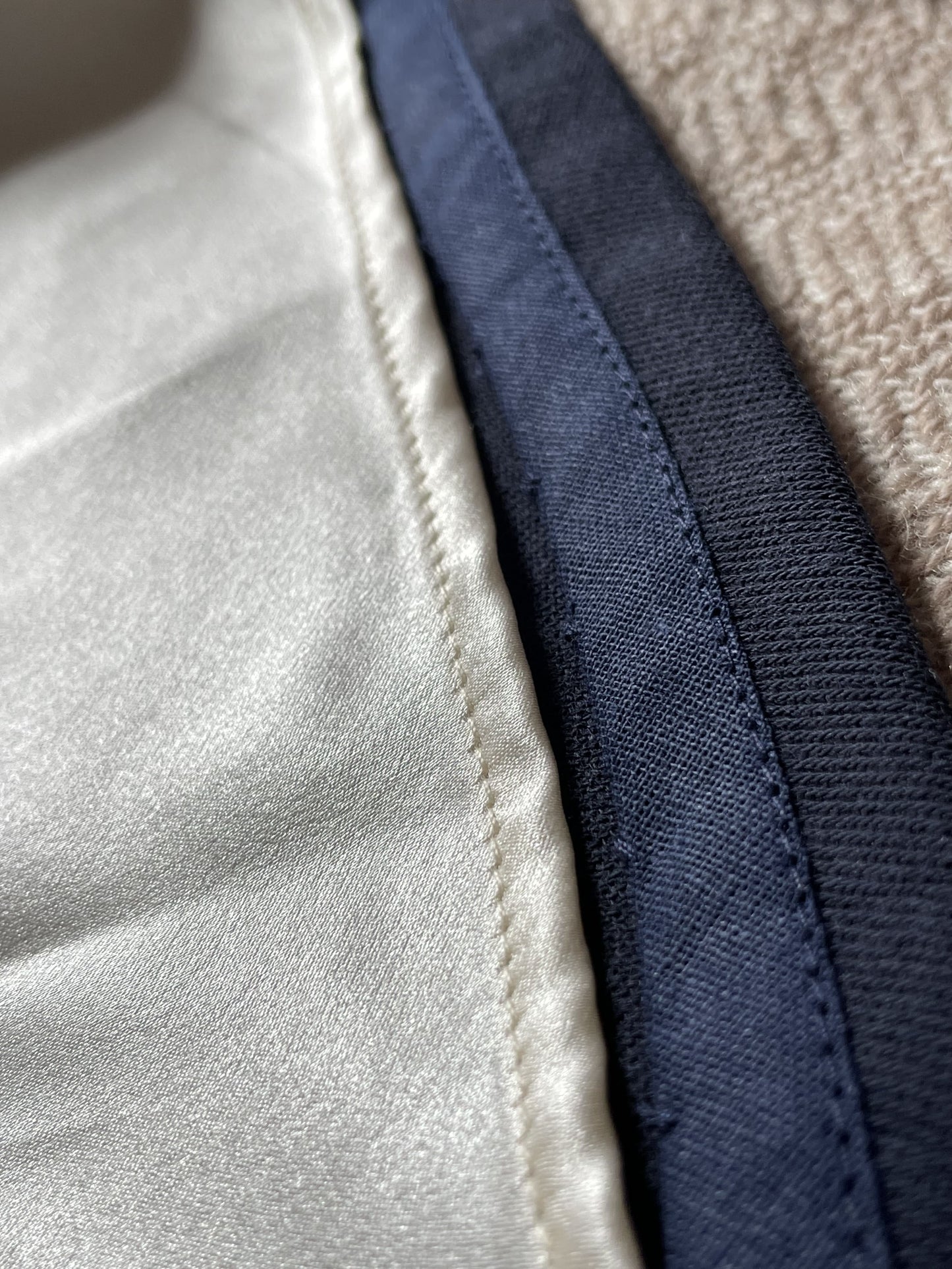 Close-up of midnight blue wool skirt and interior champagne silk lining