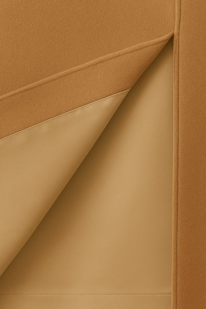 Close-up of beige cashmere with a visible beige silk lining
