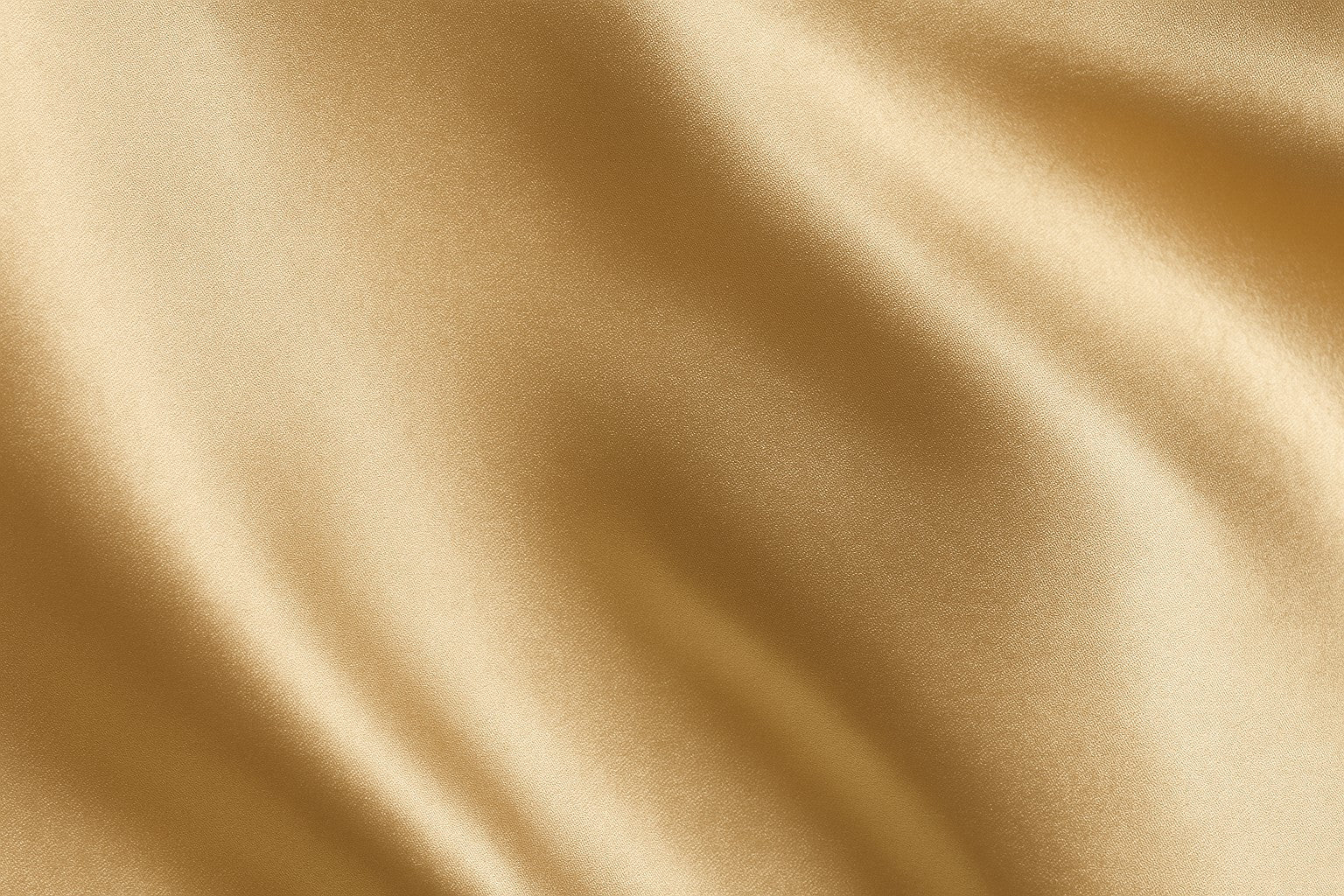 Close-up of champagne silk fabric with folds