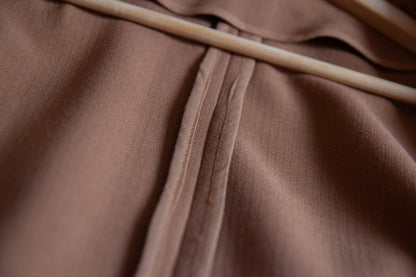 Close-up of a cropped wool crepe jacket.