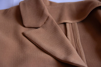 Close-up of a cropped wool jacket.