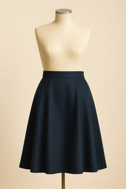 Midnight blue wool skirt on a mannequin against a beige background