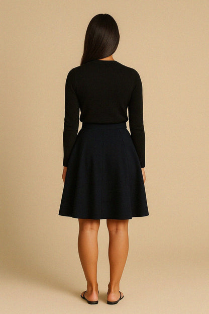 Woman wearing a midnight blue wool skirt against a beige background