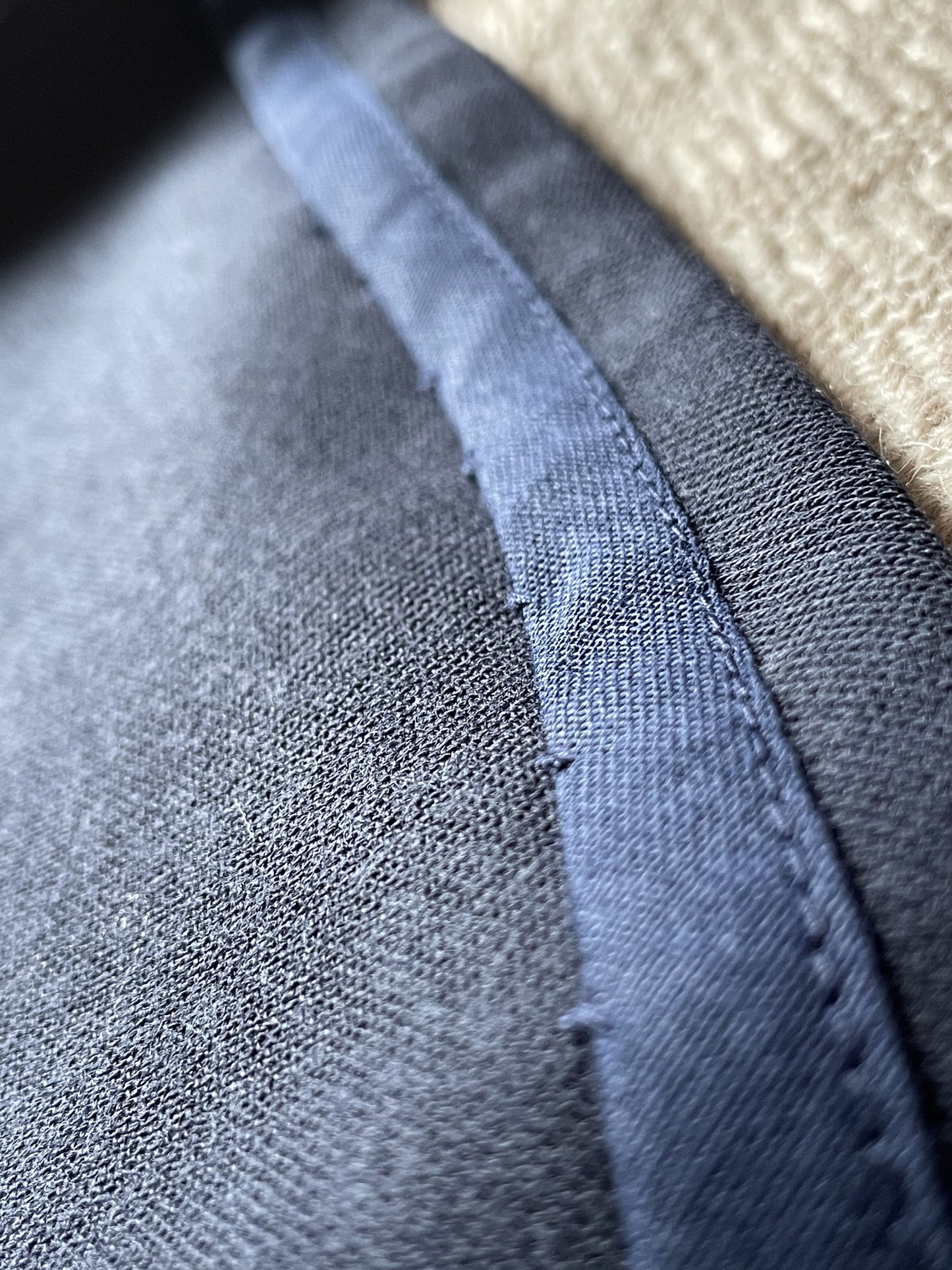 Close-up of midnight blue wool skirt hem stitch