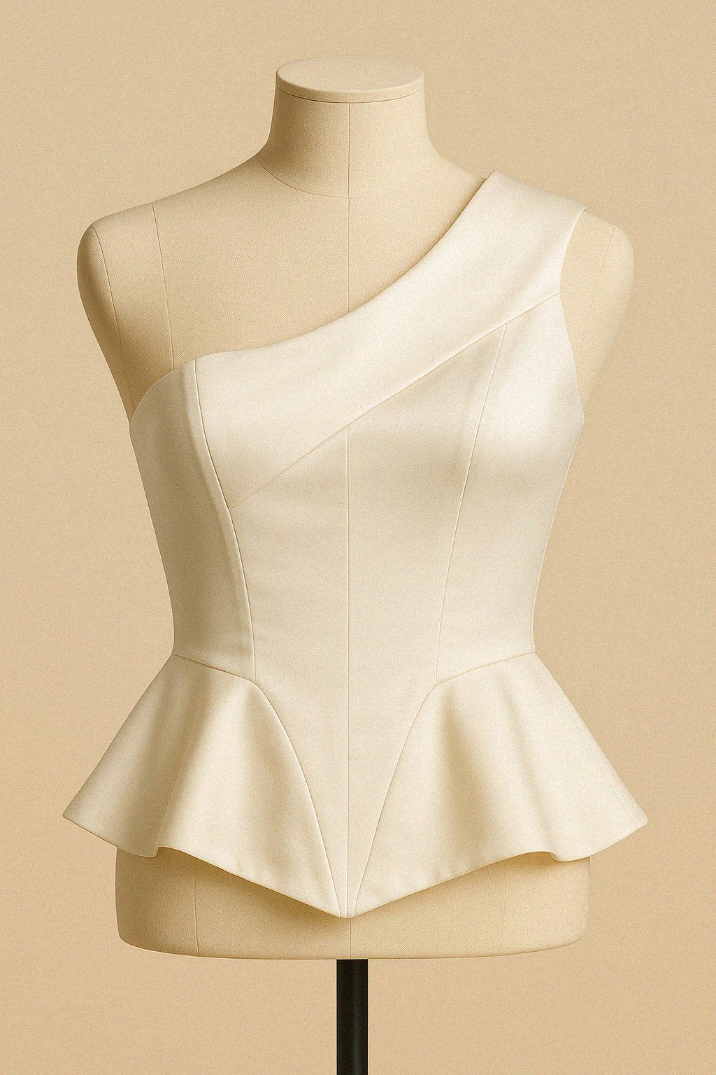 White silk top on a mannequin against a beige background by Bradic.